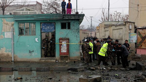 Afghan security personnel investigate the site of a blast in Kabul January 13, 2015. - Sputnik International