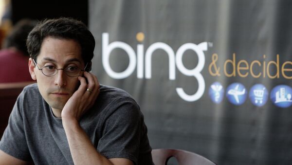 Microsoft employee Joshua Schnoll sits near a sign promoting Bing, Microsoft's recently upgraded search engine, in a company cafeteria in Redmond, Wash - Sputnik International