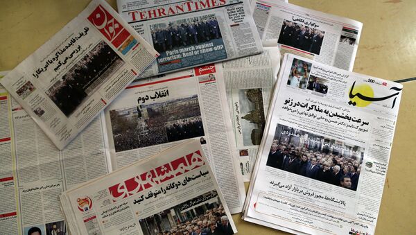 A picture taken in Tehran on January 12, 2015 shows the front pages of Iranian newspapers displaying headlines, in response to the recent Islamist attacks that killed 17 people, most at the Paris offices of satirical magazine Charlie Hebdo. - Sputnik International