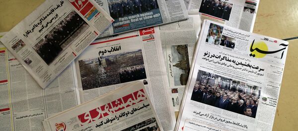 A picture taken in Tehran on January 12, 2015 shows the front pages of Iranian newspapers displaying headlines, in response to the recent Islamist attacks that killed 17 people, most at the Paris offices of satirical magazine Charlie Hebdo. - Sputnik International