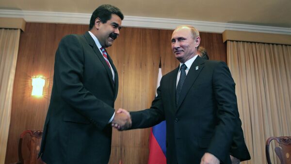 Venezuelan's Nicolas Maduro is set to meet with Russian President Vladimir Putin to discuss prospects for bilateral cooperation. Photo: Maduro and Putin meet during the BRICS-UNASUR Summit in Brasilia, Brazil, July 16, 2014 - Sputnik International
