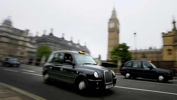 London cabs drive along Parliament Square, London, Monday, Oct. 22, 2012 - Sputnik International