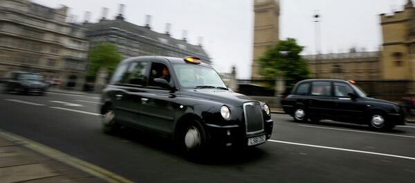 London cabs drive along Parliament Square, London, Monday, Oct. 22, 2012 - Sputnik International