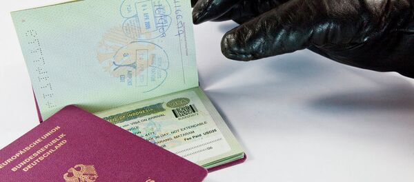Gloved thief trying to steal a passport Gloved thief trying to steal a passport - Sputnik International