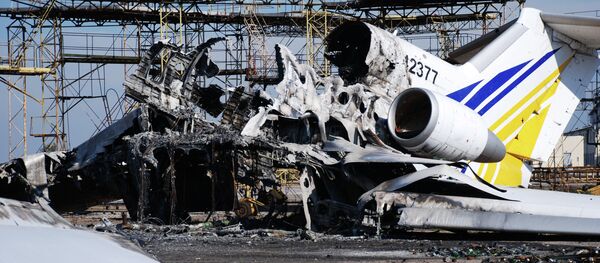 A burned plane at Donetsk airport A burned plane at Donetsk airport - Sputnik International