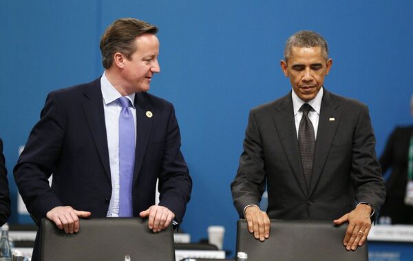 U.S. President Barack Obama and British Prime Minister David Cameron, left, take their seats at the first plenary session of the G20 summit U.S. President Barack Obama and British Prime Minister David Cameron, left, take their seats at the first plenary session of the G20 summit - Sputnik International