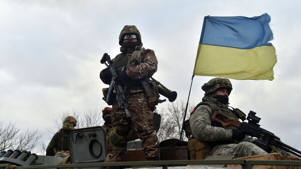 Ukrainian soldiers ride on a armored personnel vehicle outside the eastern Ukrainian city of Debaltseve - Sputnik International