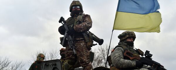 Ukrainian soldiers ride on a armored personnel vehicle outside the eastern Ukrainian city of Debaltseve Ukrainian soldiers ride on a armored personnel vehicle outside the eastern Ukrainian city of Debaltseve - Sputnik International