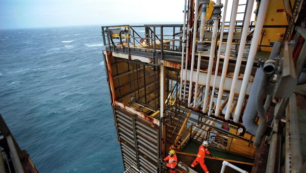 A picture shows employees working on the BP ETAP (Eastern Trough Area Project) oil platform in the North Sea, around 100 miles east of Aberdeen, Scotland on February 24, 2014 - Sputnik International