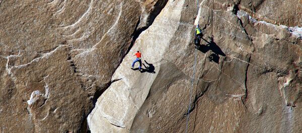In this Dec. 28, 2014 photo provided by Tom Evans, Tommy Caldwell ascends what is known as pitch 10 on what has been called the hardest rock climb in the world: a free climb of a El Capitan, the largest monolith of granite in the world, a half-mile section of exposed granite in California's Yosemite National Park. In this Dec. 28, 2014 photo provided by Tom Evans, Tommy Caldwell ascends what is known as pitch 10 on what has been called the hardest rock climb in the world: a free climb of a El Capitan, the largest monolith of granite in the world, a half-mile section of exposed granite in California's Yosemite National Park. - Sputnik International