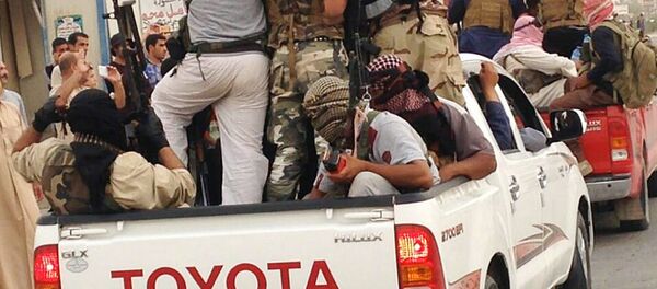 In this Tuesday, July 29, 2014, file photo, Islamic militants parade in Beiji, some 250 kilometers (155 miles) north of the capital, Baghdad, Iraq In this Tuesday, July 29, 2014, file photo, Islamic militants parade in Beiji, some 250 kilometers (155 miles) north of the capital, Baghdad, Iraq - Sputnik International