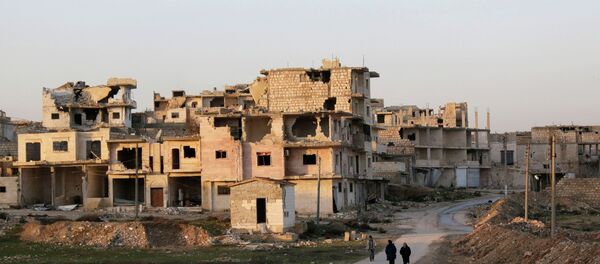 Residents walk near damaged buildings in Maaret al-Naaman town in Idlib province January 14, 2015 (file) Residents walk near damaged buildings in Maaret al-Naaman town in Idlib province January 14, 2015 (file) - Sputnik International