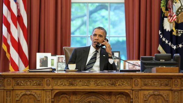 President Barack Obama talks with President Hassan Rouhani of Iran during a phone call in the Oval Office, September 27, 2013 - Sputnik International