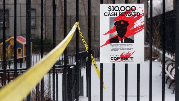 A sign posted near the site of a shooting is seen in the Bronx borough of New York January 6, 2015 - Sputnik International