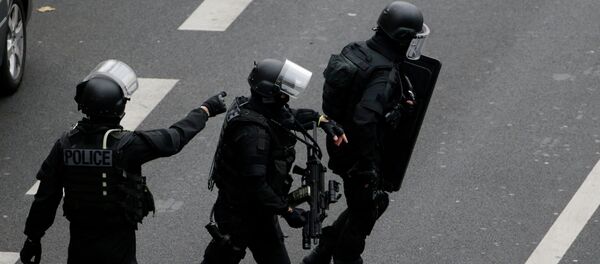 Members of the French national police intervention group (BRI) prepare to carry out searches in the vicinity of where a female police officer was shot dead in Montrouge, a southern suburb of Paris on January 8, 2015, a day after Islamist gunmen stormed the office of satirical magazine Charlie Hebdo, Members of the French national police intervention group (BRI) prepare to carry out searches in the vicinity of where a female police officer was shot dead in Montrouge, a southern suburb of Paris on January 8, 2015, a day after Islamist gunmen stormed the office of satirical magazine Charlie Hebdo, - Sputnik International