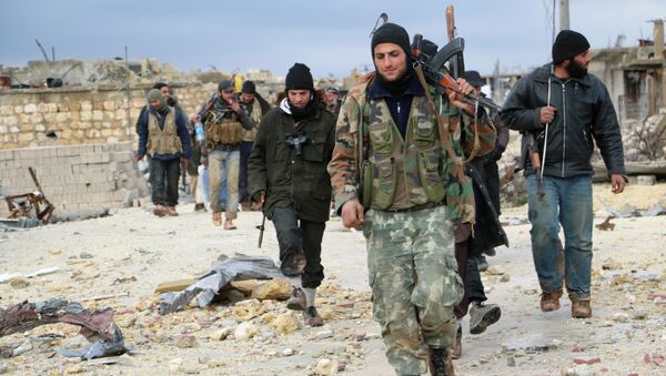 Opposition fighters walk in the al-Breij area northwest on the northern Syrian city of Aleppo after they reportedly re-took control of the area from pro-government forces on January 7, 2015 - Sputnik International