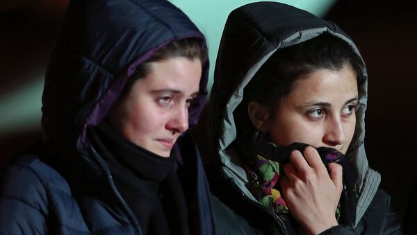 Greta Ramelli (L) and Vanessa Marzullo, two Italian aid workers taken hostage in Syria five months ago, arrive at Ciampino airport in Rome January 16, 2015 - Sputnik International