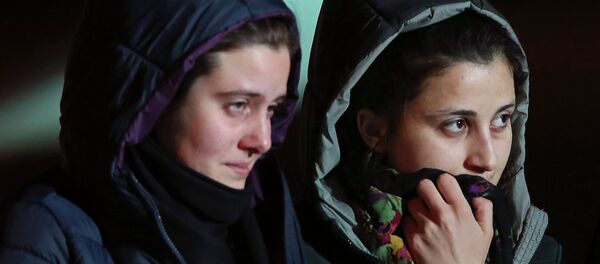 Greta Ramelli (L) and Vanessa Marzullo, two Italian aid workers taken hostage in Syria five months ago, arrive at Ciampino airport in Rome January 16, 2015 - Sputnik International