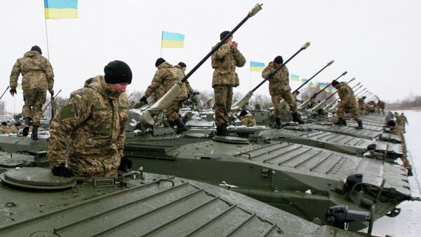 Ukrainian servicemen get inside armoured personnel carriers (APC) during a ceremony to hand over weapons, military equipment and aircraft to the army at a firing range outside Zhytomyr January 5, 2015 - Sputnik International