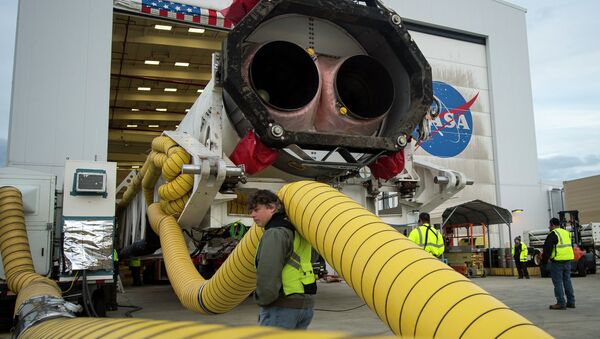 An Orbital Sciences Corporation Antares rocket is seen as it is rolled out to launch Pad-0A at NASA's Wallops Flight Facility, Wallops Island, Va., Sunday, Jan. 5, 2014 - Sputnik International