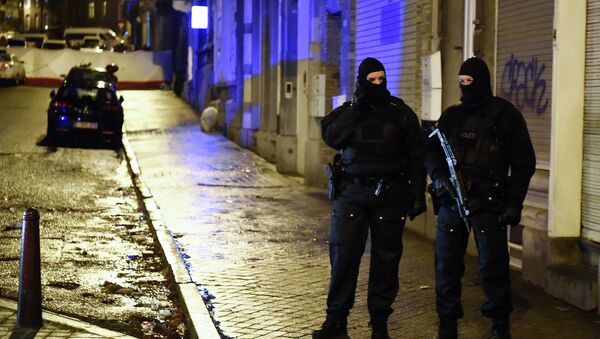 Police stands guard in Verviers, eastern Belgium, on January 15, 2015, after two men were reportedly killed during an anti-terrorist operation - Sputnik International