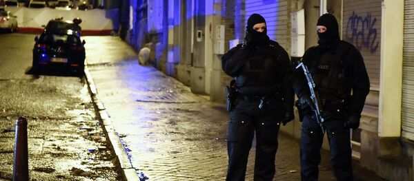 Police stands guard in Verviers, eastern Belgium, on January 15, 2015, after two men were reportedly killed during an anti-terrorist operation Police stands guard in Verviers, eastern Belgium, on January 15, 2015, after two men were reportedly killed during an anti-terrorist operation - Sputnik International