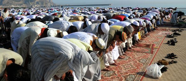 Muslims pray during Eid al-Fitr prayer, which marks the end of the holy month of Ramadan, in Palermo, Italy Muslims pray during Eid al-Fitr prayer, which marks the end of the holy month of Ramadan, in Palermo, Italy - Sputnik International