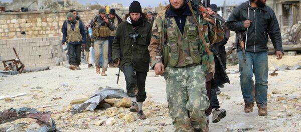 Opposition fighters walk in the al-Breij area northwest on the northern Syrian city of Aleppo Opposition fighters walk in the al-Breij area northwest on the northern Syrian city of Aleppo - Sputnik International