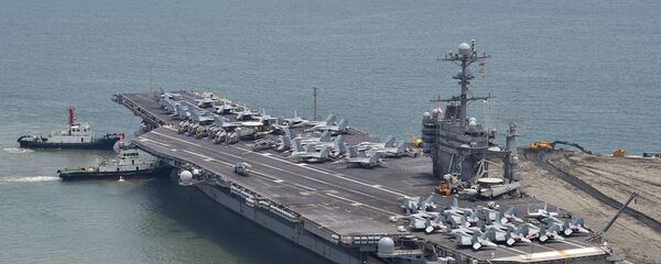 The US nuclear powered aircraft carrier USS George Washington arrives at the southeastern port city of Busan on July 11, 2014 - Sputnik International
