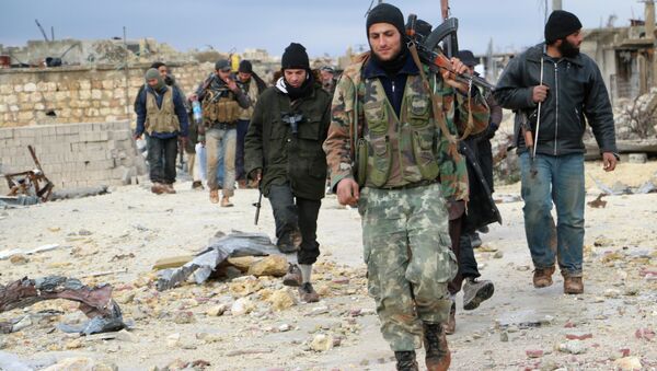 Opposition fighters walk in the al-Breij area northwest on the northern Syrian city of Aleppo - Sputnik International