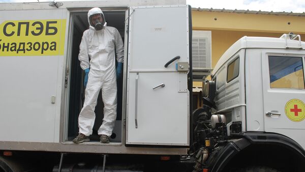 Russian doctor Valentine Safronov stands inside a mobile medical lab donated by the Russian government to assist with the Ebola outbreak in Conakry, Guinea. - Sputnik International