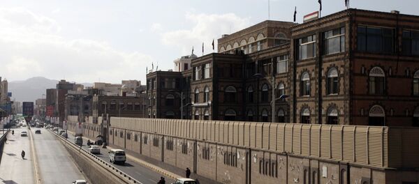 Vehicles drive past the office building of Ahmed Awadh bin Mubarak, in Sanaa January 17, 2015 Vehicles drive past the office building of Ahmed Awadh bin Mubarak, in Sanaa January 17, 2015 - Sputnik International