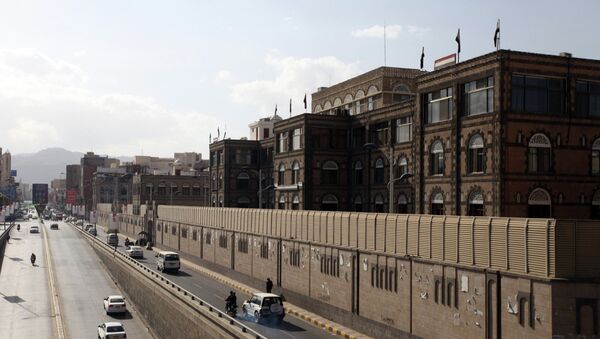 Vehicles drive past the office building of Ahmed Awadh bin Mubarak, in Sanaa January 17, 2015 - Sputnik International