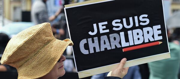 A woman holds a sign during a demonstration at the Bolivar square in Bogota on January 14, 2015 A woman holds a sign during a demonstration at the Bolivar square in Bogota on January 14, 2015 - Sputnik International