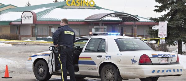 Police contain the scene where two RCMP officers were shot in St. Albert, Alberta, Canada, on Saturday, Jan. 17, 2015 Police contain the scene where two RCMP officers were shot in St. Albert, Alberta, Canada, on Saturday, Jan. 17, 2015 - Sputnik International
