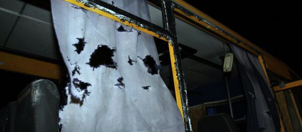 A view of the shattered windows and the torn curtains of a bus hit during shelling apparently aimed at a checkpoint manned by Ukrainian forces in Volnovakha, in the eastern Donetsk region, on January 13, 2015 A view of the shattered windows and the torn curtains of a bus hit during shelling apparently aimed at a checkpoint manned by Ukrainian forces in Volnovakha, in the eastern Donetsk region, on January 13, 2015 - Sputnik International