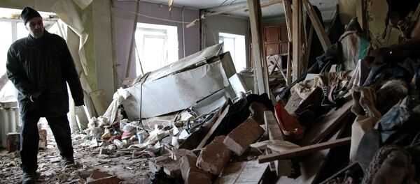 Local resident Nikolai, 82, inspects his apartment, which according to locals, was recently destroyed by shelling, in Donetsk - Sputnik International