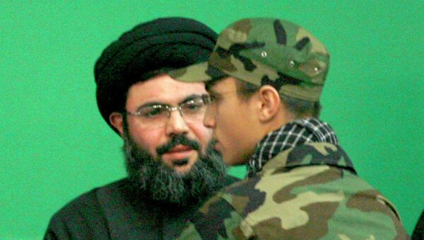 Jihad Moughniyah (R), son of Lebanon's Hezbollah late military leader Imad Moughniyah, greets Sayyed Hashem Safieddine, head of Hezbollah's Executive Council, as they attend a ceremony marking a week of his father's death in Beirut's suburbs in this February 22, 2008 file photo. - Sputnik International
