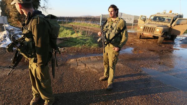 Israeli troops patrol the Israeli-occupied sector of the Golan Heights on January 18, 2015. - Sputnik International