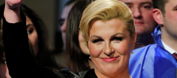 Kolinda Grabar-Kitarovic of the opposition HDZ celebrates her victory in Croatia's presidential run-off election on the stage at her campaign headquarters in Zagreb January 11, 2015. - Sputnik International