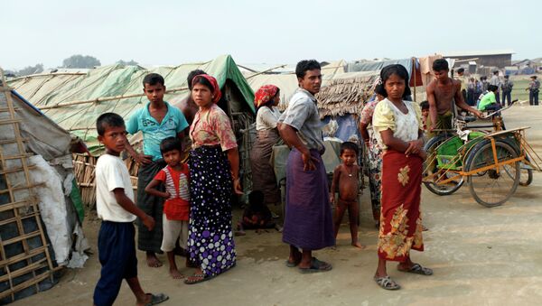 Myanmar Muslims, who identify themselves as long-persecuted “Rohingya” Muslims stand outside their tents at Da Paing camp for Muslim refugees in north of Sittwe, Rakhine State, western Myanmar - Sputnik International