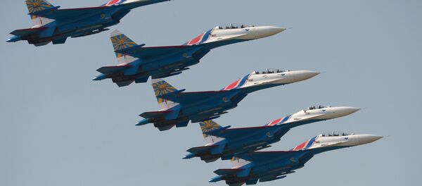 Su-27 fighter aircraft of the aerobatic display team Russkye Vityazi (Russian Knights) during the Air Force Day celebration in Lipetsk. Su-27 fighter aircraft of the aerobatic display team Russkye Vityazi (Russian Knights) during the Air Force Day celebration in Lipetsk. - Sputnik International
