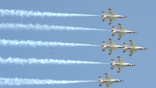 Aircraft of the 'Thunderbirds' US Air Force Air Demonstration Squadron fly as they perform during an air show at Don Muang airport in Bangkok - Sputnik International