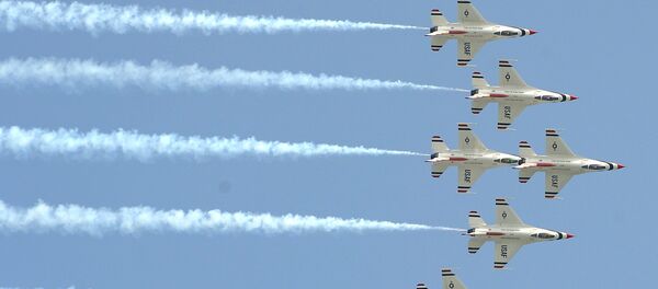 Aircraft of the 'Thunderbirds' US Air Force Air Demonstration Squadron fly as they perform during an air show at Don Muang airport in Bangkok Aircraft of the 'Thunderbirds' US Air Force Air Demonstration Squadron fly as they perform during an air show at Don Muang airport in Bangkok - Sputnik International