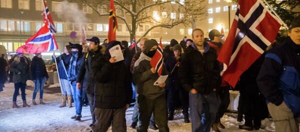 Norwegian sympathizers of the German right-wing populist movement PEGIDA (Patriotic Europeans Against the Islamisation of the Occident) carrying Norwegian flags march in Oslo - Sputnik International