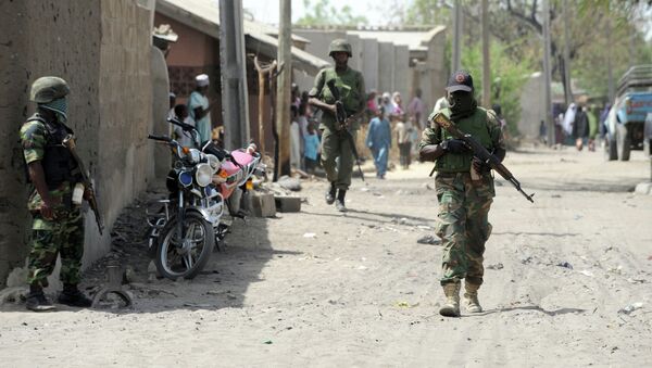 Soldiers walk in the street in the remote northeast town of Baga, Borno State. - Sputnik International