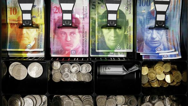 Swiss franc coins are seen in a cash drawer in this picture illustration in Bern - Sputnik International