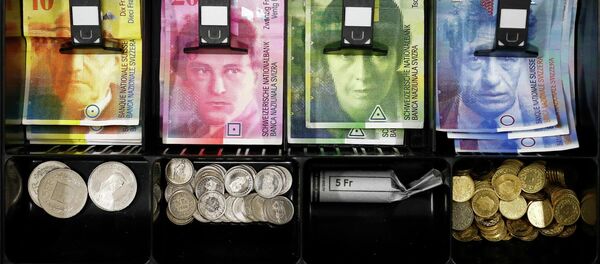 Swiss franc coins are seen in a cash drawer in this picture illustration in Bern - Sputnik International