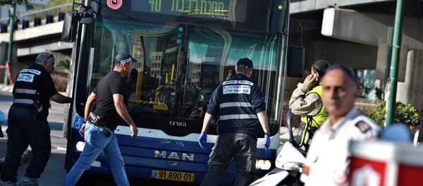 Israeli police crime scene investigators work at the scene of a stabbing attack in Tel Aviv January 21, 2015. - Sputnik International