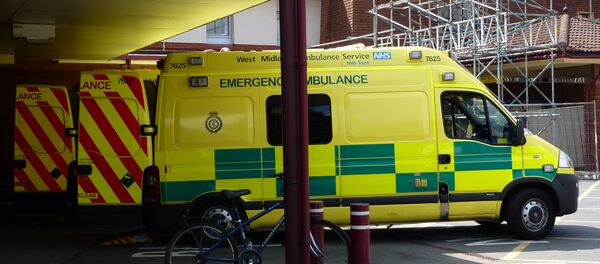A row of NHS West Midlands Ambulance Service emergency ambulances, outside the Accident & Emergency department of Warwick Hospital. A row of NHS West Midlands Ambulance Service emergency ambulances, outside the Accident & Emergency department of Warwick Hospital. - Sputnik International